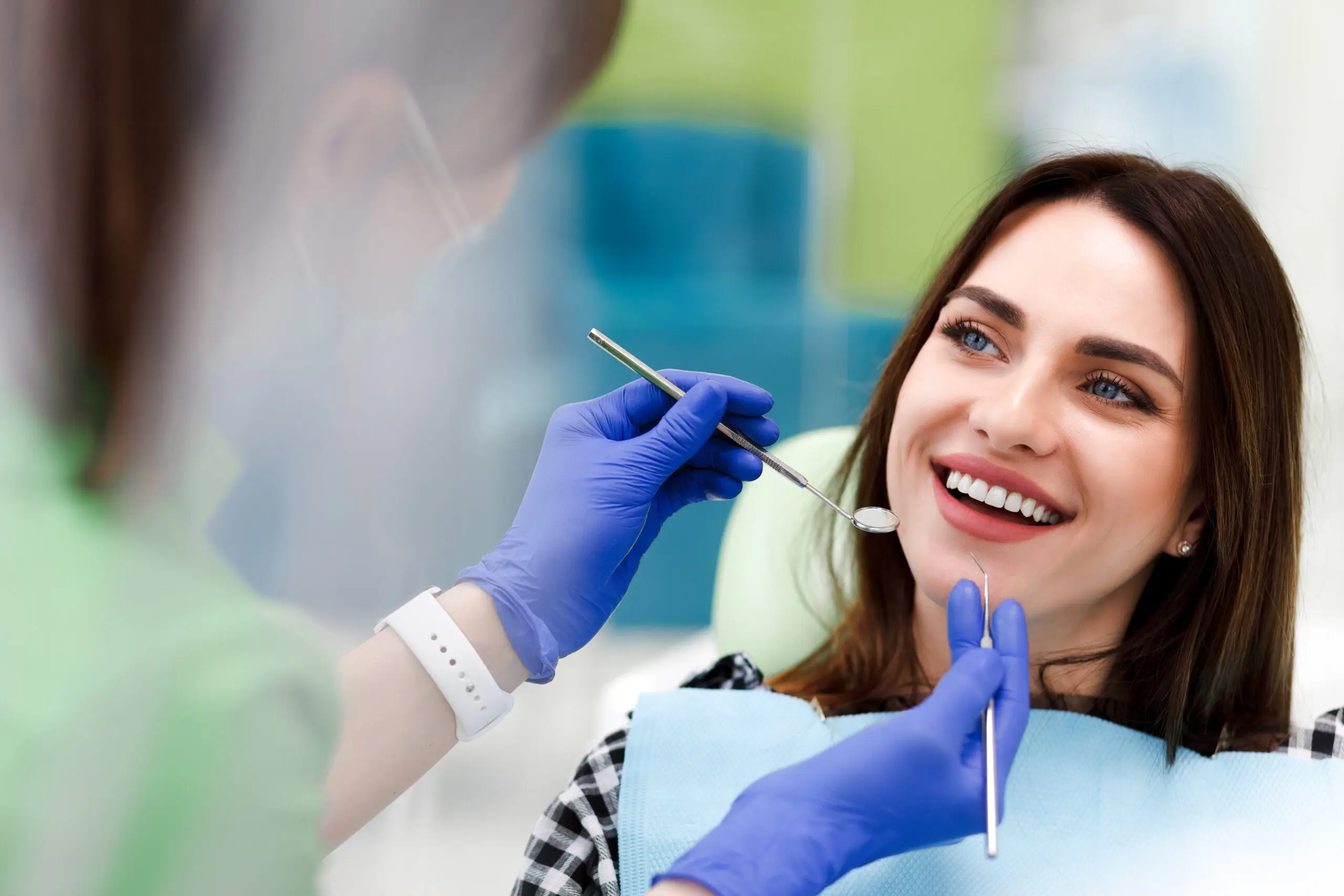 Woman smiling during dental check-up.