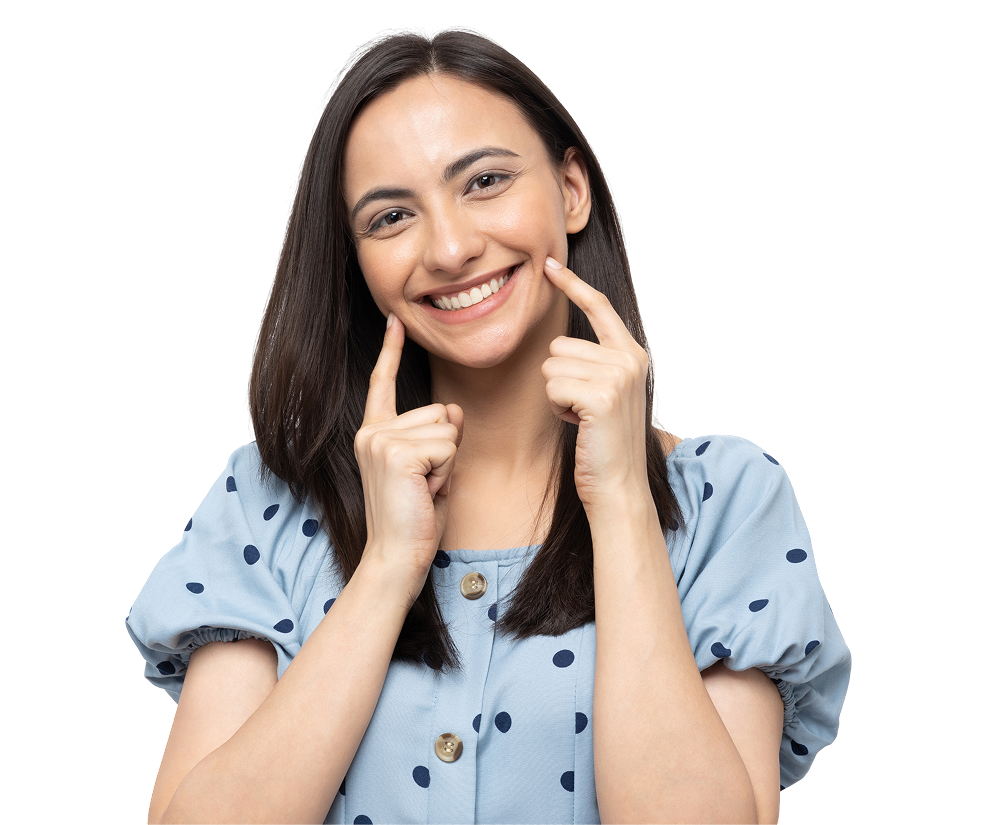 Smiling woman pointing at her cheeks.