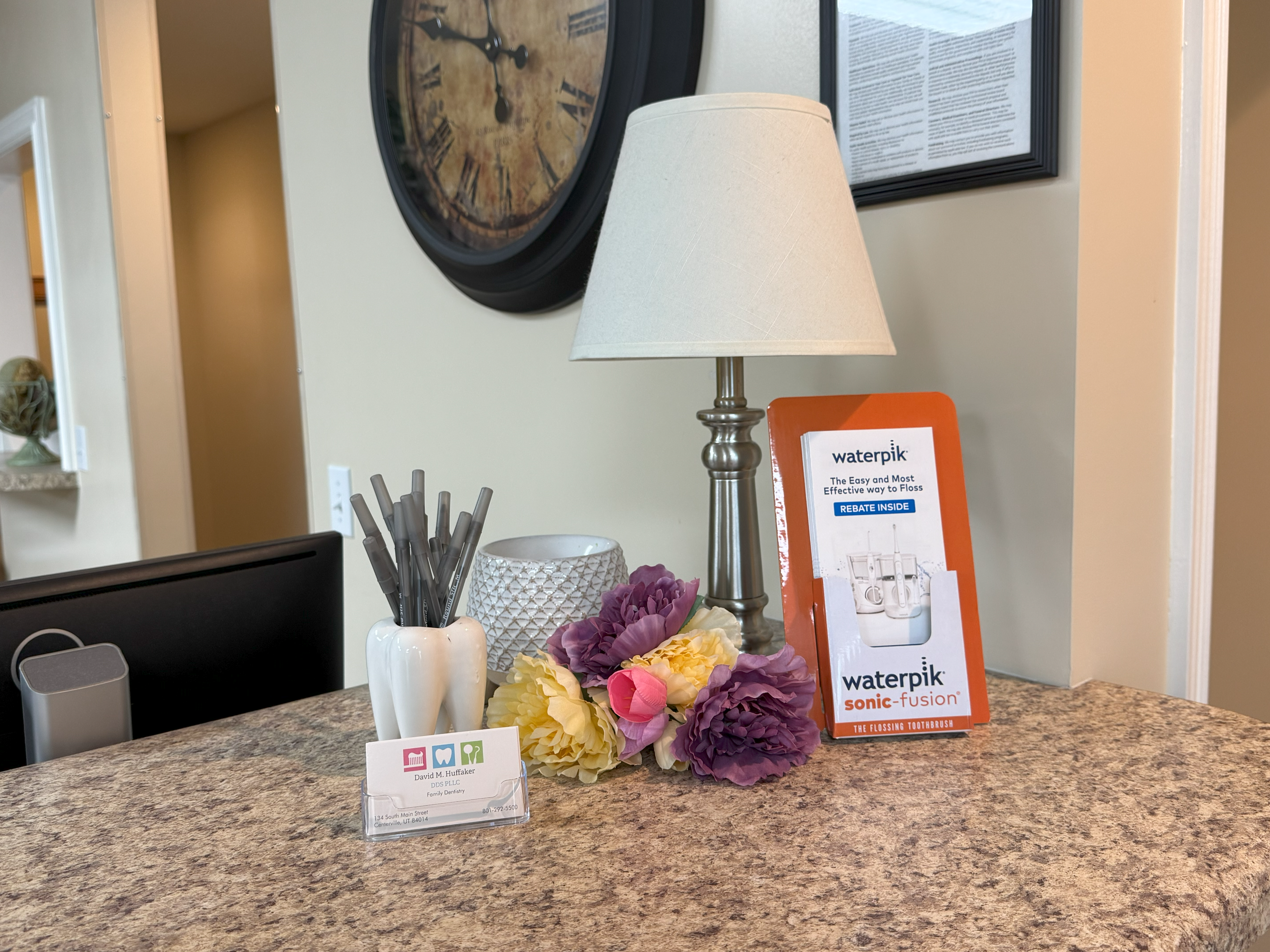 A table with some papers and a lamp