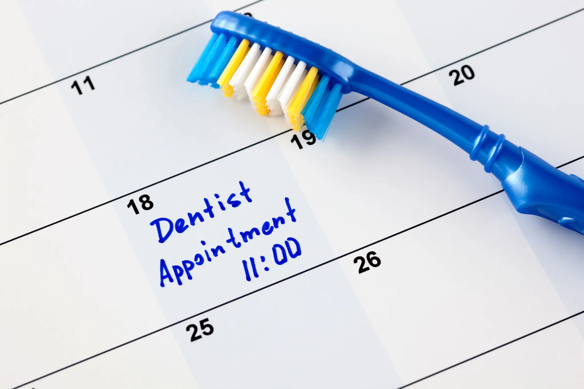 680189bab9668_4a0ca3a1-69c5-401d-a27c-e1aae52e0990 A blue toothbrush and some white teeth on the calendar
