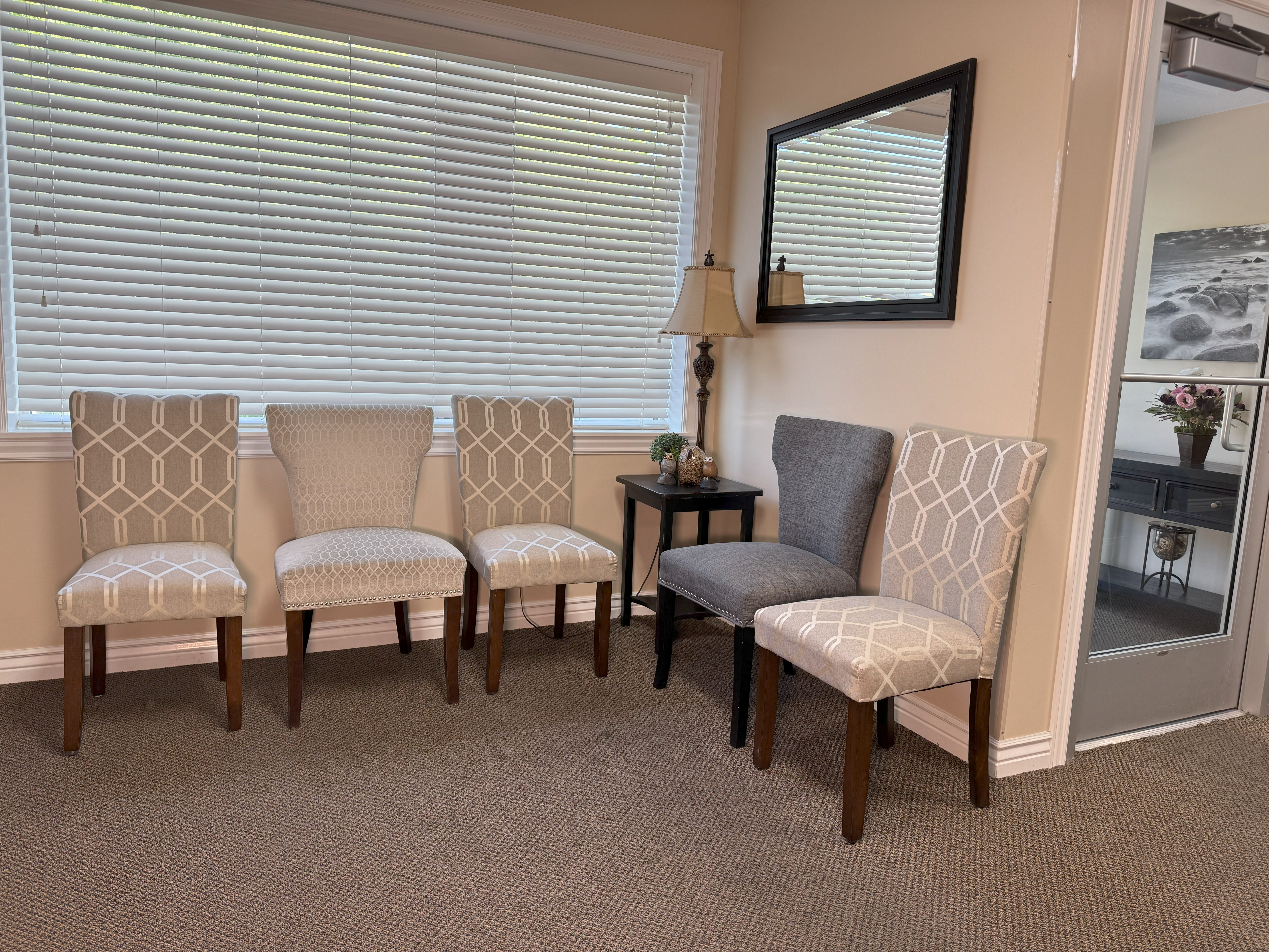 A room with four chairs and a table